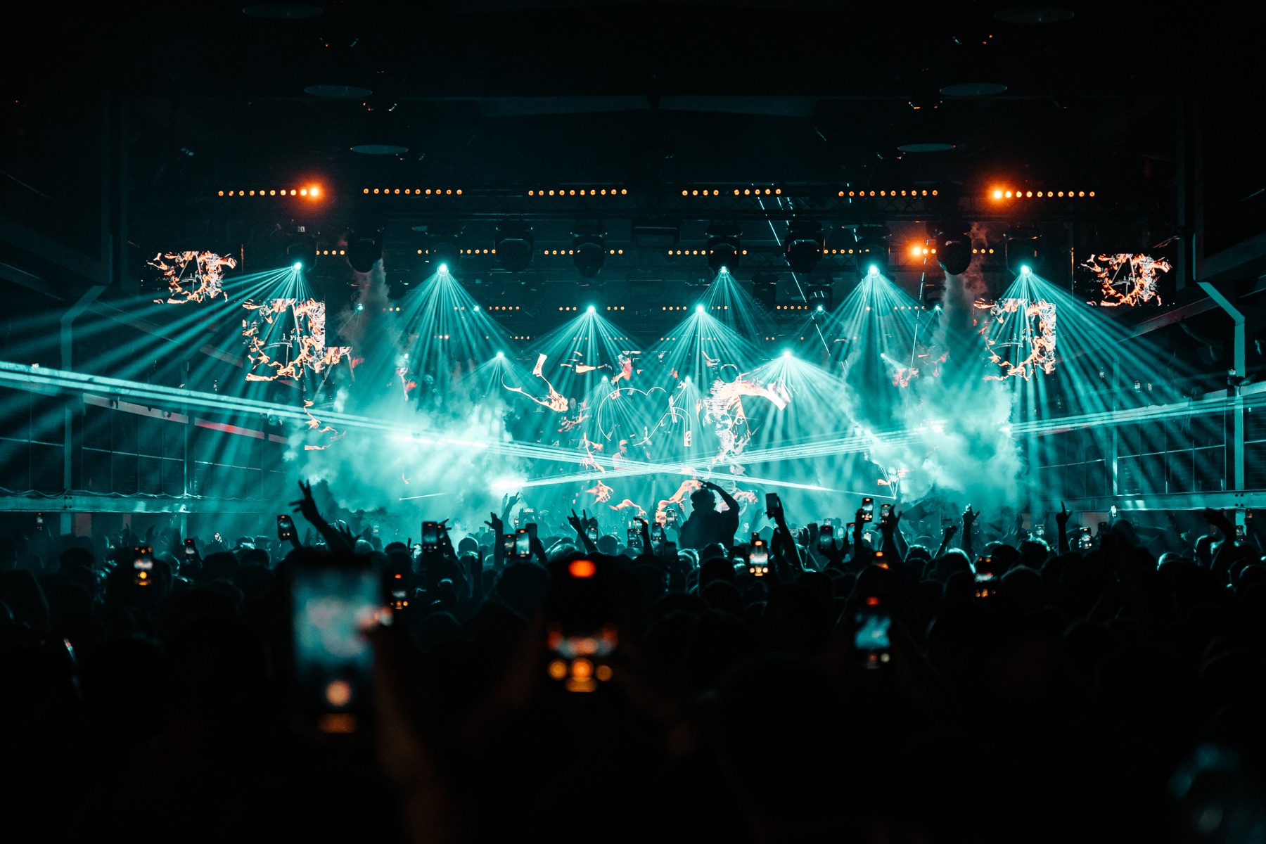 BASSIZM — panoramic view of the stage and turquoise light show